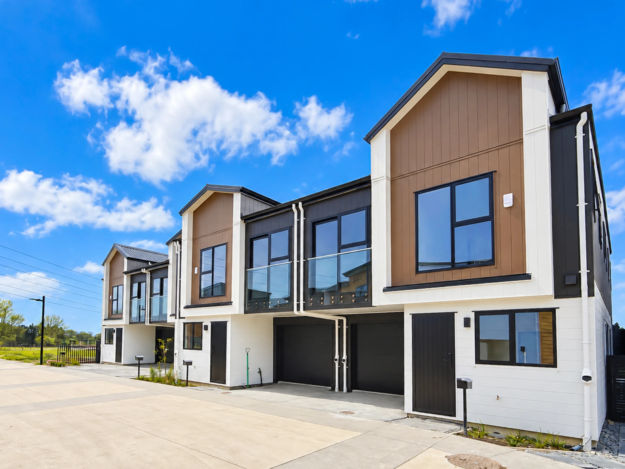 Contemporary Riverside homes with balconies and contrasting exterior cladding