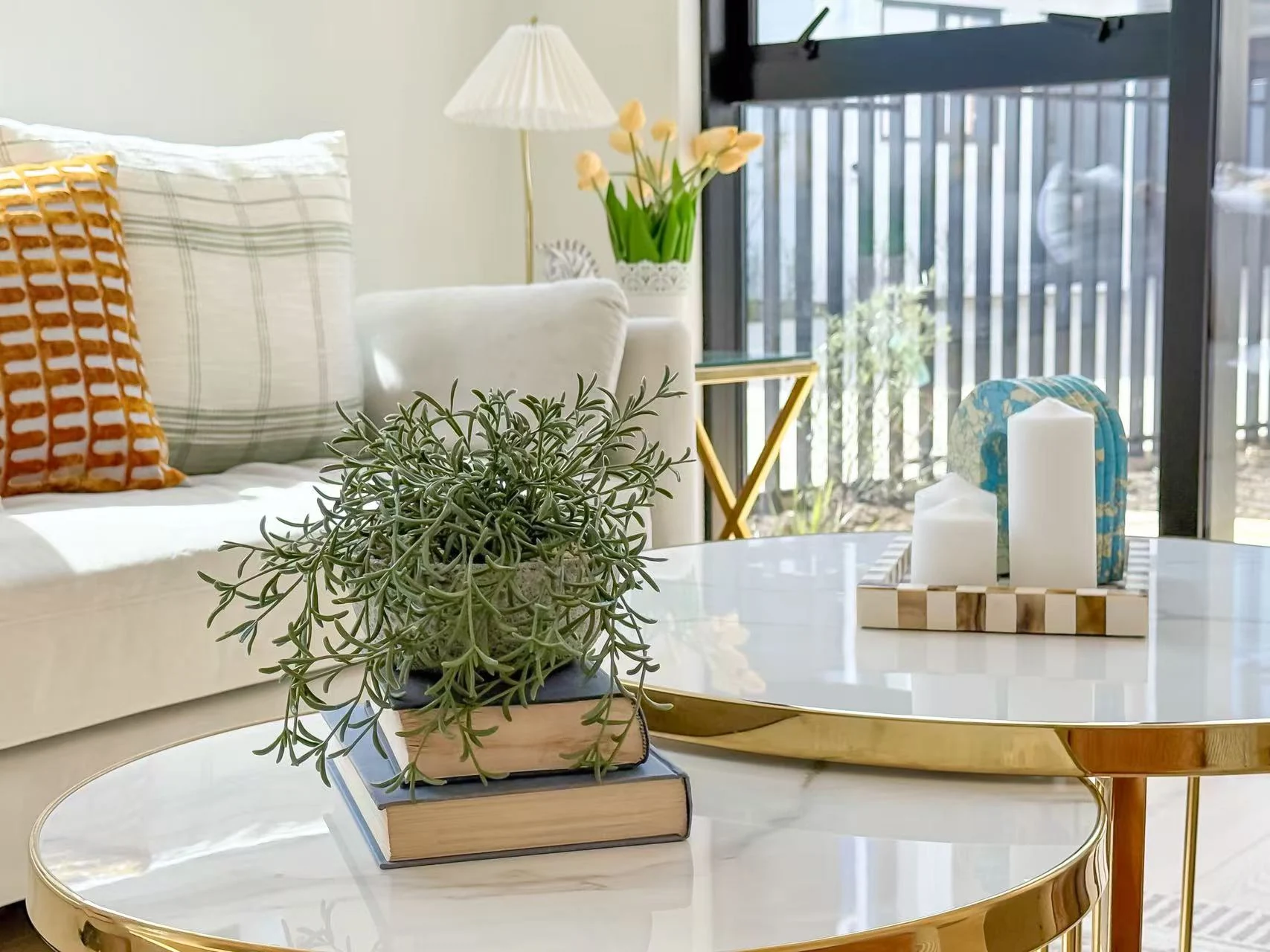 Styled coffee table and sofa in a furnished living room