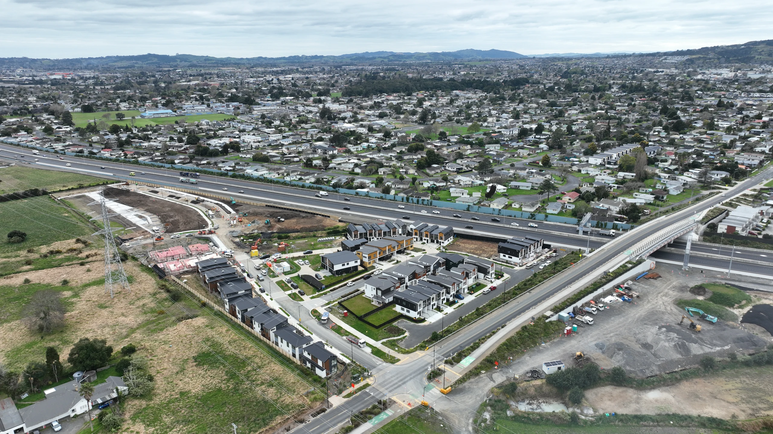 Aerial view of Riverside housing, construction areas and surrounding roads and neighbourhood